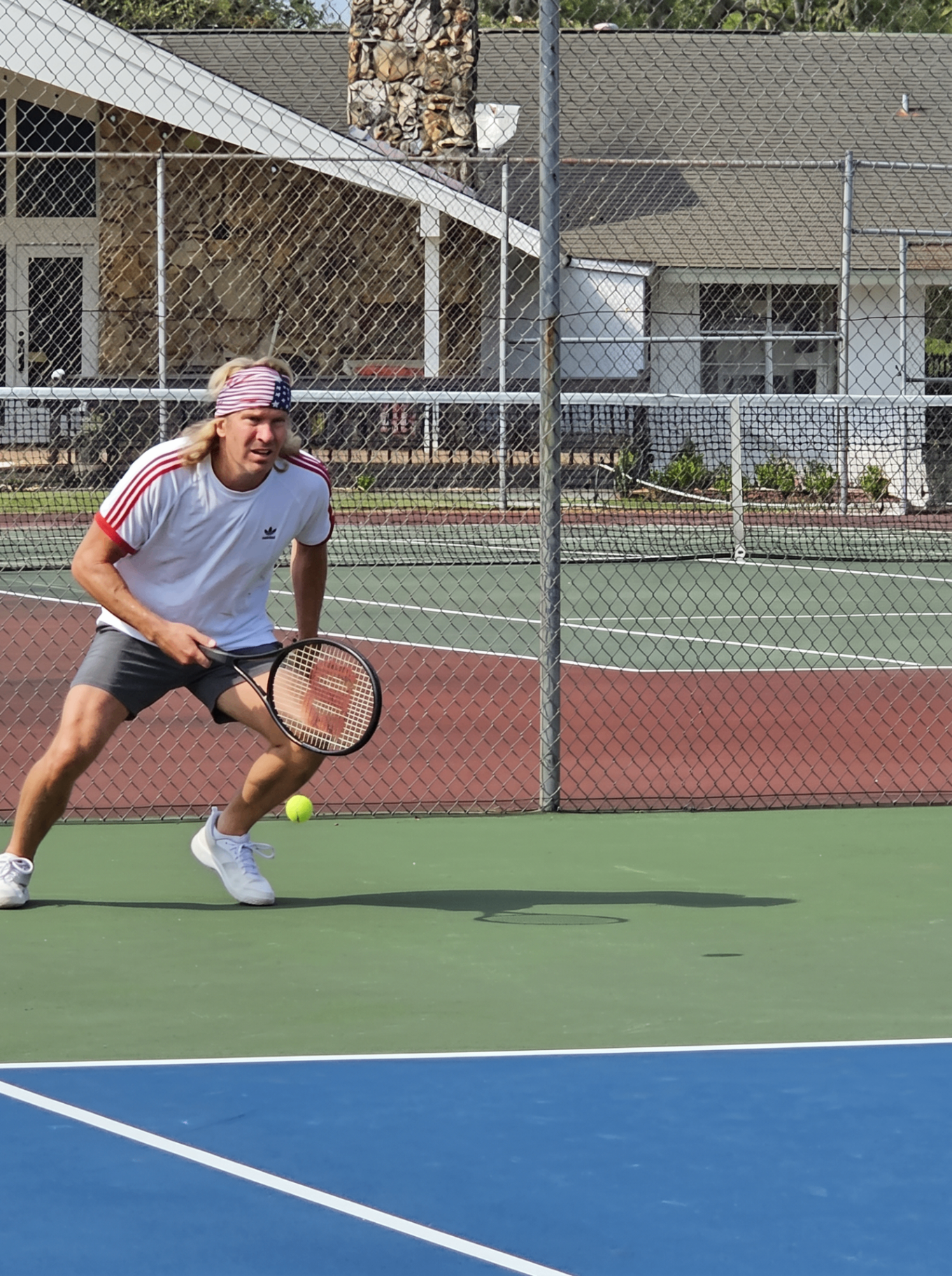 Tennis player in athletic ready position on the court