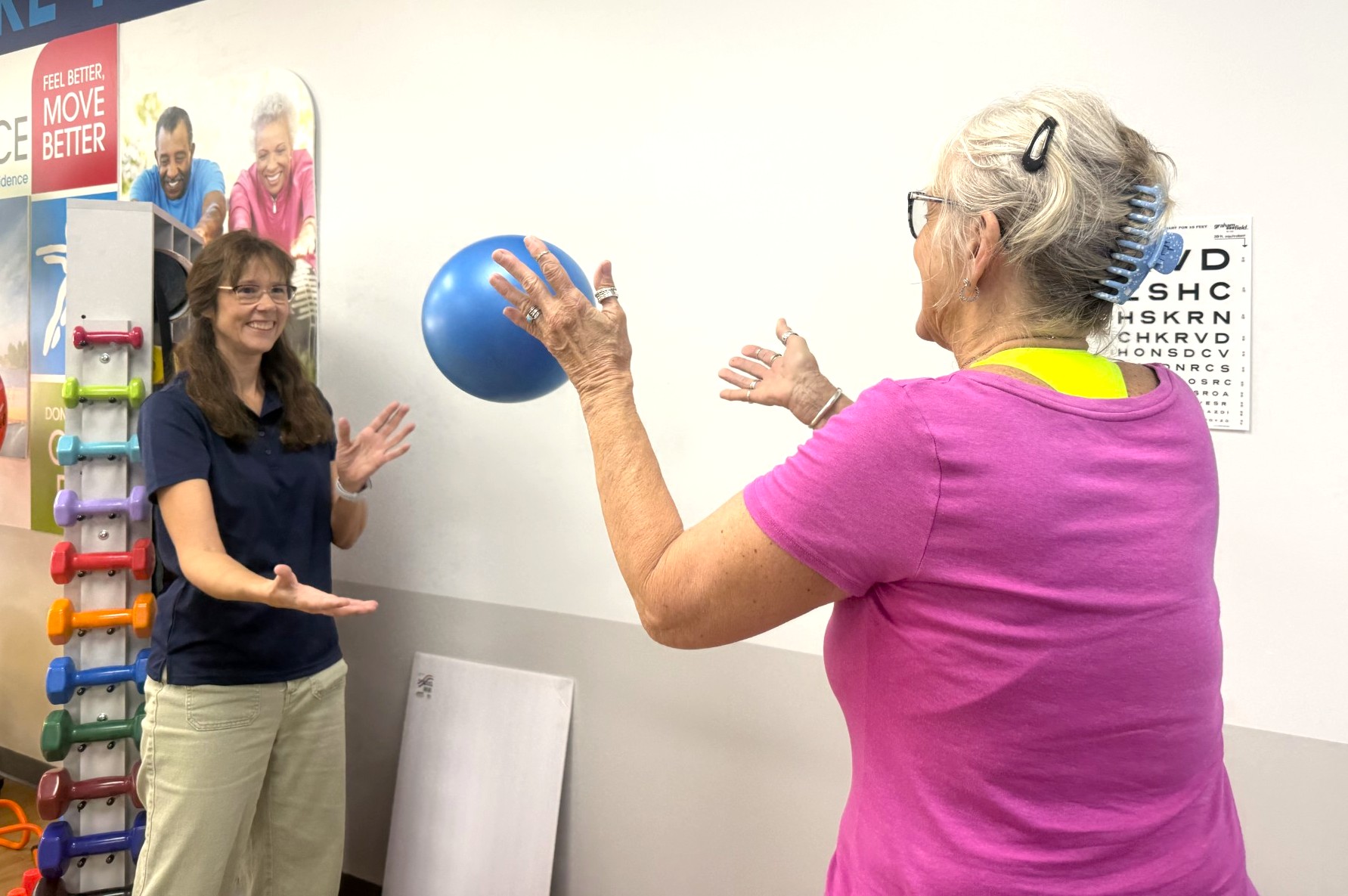 Therapist guiding patient through coordination exercise