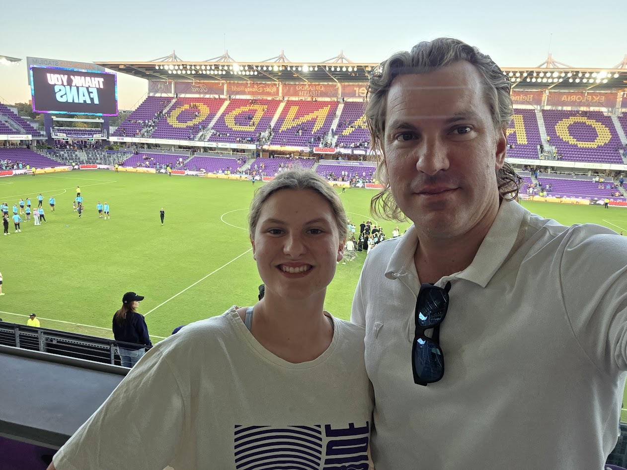 Rob and his daughter at Orlando City stadium after a match